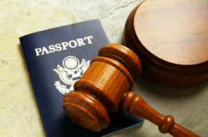 US passport and judges court gavel, from above in Immigration Court 